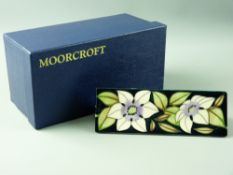 A MOORCROFT 'SOPHIE CHRISTINA' TRIANGULAR ADVERTISING PLAQUE, decorated on a blue/green