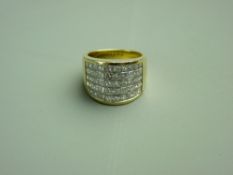 AN EIGHTEEN CARAT GOLD DRESS RING with fifty tiny diamonds in five rows of ten stones each, size '