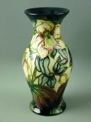 A MOORCROFT 'ASHWOOD HELLEBORE' WAISTED VASE, designed by Nicola Slaney and decorated on a multi-