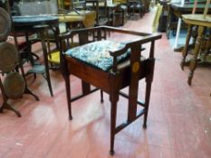 AN EDWARDIAN INLAID MAHOGANY PIANO STOOL, the lidded box seat on turned and block supports with