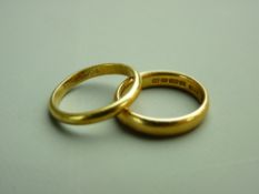 TWO GOLD WEDDING BANDS, an eighteen carat gold example, 2.6 grms gross, size 'K', the other twenty