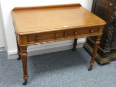 A VICTORIAN MAHOGANY SIDE TABLE, the rectangular top with shaped railback and moulded edge over a