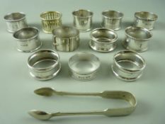 EIGHT HALLMARKED SILVER NAPKIN RINGS, four EPNS and a pair of sugar tongs, 4 troy ozs weighable