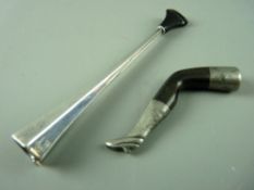 AN ART DECO DUNHILL, PARIS CIGARETTE HOLDER and a horn and white metal pipe tamper in the form of