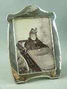 A HALLMARKED SILVER PHOTOGRAPH FRAME with wooden easel stand, inscribed to the front 'Charlotte