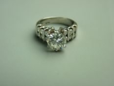 A FOURTEEN CARAT WHITE GOLD DIAMOND DRESS RING having a fine white colour solitaire diamond 8mm