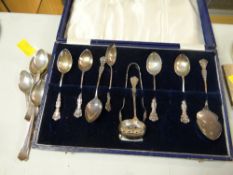 A boxed set of hallmarked teaspoons together with sugar nips, strainer & preserve spoon together