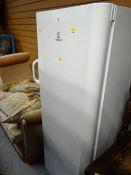 An Indesit upright fridge
