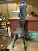 Small darkwood carved spinning chair