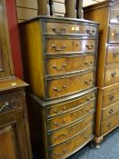A reproduction flame mahogany small chest-on-chest