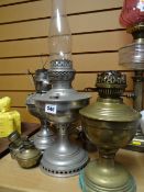 Collection of oil lamp bases together with a glass shade (for spares)