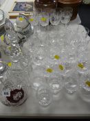 Three cut glass decanters & a quantity of good quality drinking glasses
