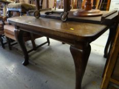 A vintage oak extending dining table