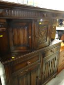 A linen-fold style court cupboard