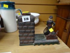 A vintage cast metal artillery bank money box