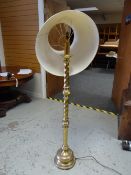A vintage brass effect barley-twist column standard lamp