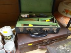 A vintage cased clarinet together with a small travel case