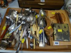 A tray of various flatware