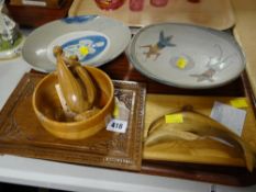 Two studio pottery animal patterned dishes, North American carved wood items
