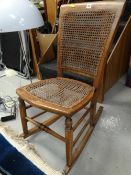 A bergere seated & backed small rocking chair
