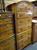 A reproduction dome topped walnut veneered chest-on-chest