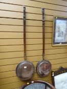 Two vintage copper bed warming pans