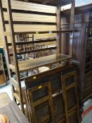 Three dark stained folding bookshelves