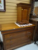 A reproduction mahogany three-drawer chest of drawers together with a matching pot / bedside