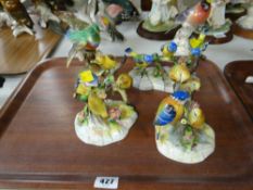 Three Royal Adderley bird figures together with a Crown Staffordshire, blue tit & young