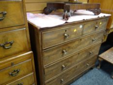 A light-wood nineteenth century chest of drawers, two short above three long with brass handles