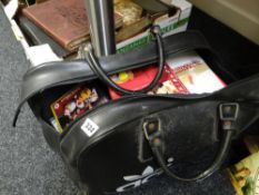 Collection of various DVDs contained in a vintage black Adidas holdall