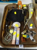 Tray of various collectables including carved figures, metal banded horns, buckles etc