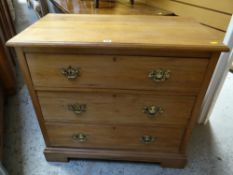 A satinwood three-drawer chest of drawers