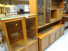 A modern Meredew lightwood lounge / display unit together with a similar display cabinet