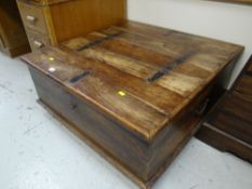 A teak square chest for use as coffee table / TV stand