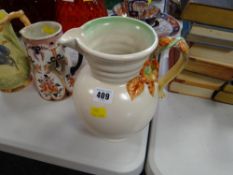 A Clarice Cliff Newport pottery flower handled jug
