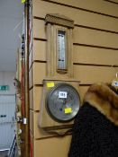 A light oak barometer/ thermometer