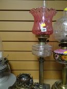 Corinthian columned clear glass reservoir & cranberry glass shade oil lamp