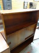 A Danish lounge unit with sliding centre doors & shelves