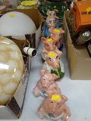 A set of seven Natwest piggy money banks