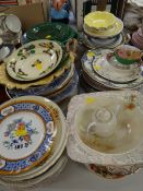 A quantity of mixed china plates including green leaf moulded dishes