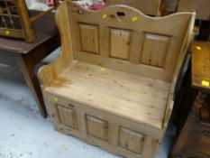 A small stripped pine settle