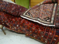 A large blue and red ground Iranian rug, together with a similar runner 204 x 82cms