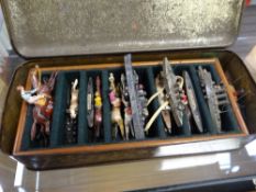 Vintage biscuit tin containing painted Escalado horses & battleships etc