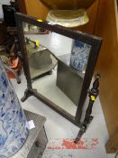 A darkwood vintage toilet mirror