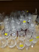 A large quantity of drinking glasses