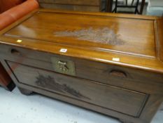 A camphor chest with carved decoration