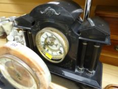 A nineteenth century American slate architectural mantel clock