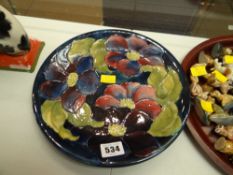 A Moorcroft blue ground floral dish