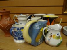 A quantity of mixed pottery jugs